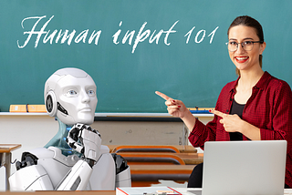 An AI robot sits in a classroom while a female teacher points to a chalkboard.