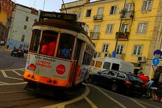 A tiny tram in Lisbon , Portugal