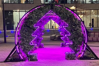 Purple and green chirstmas tree shaped archway