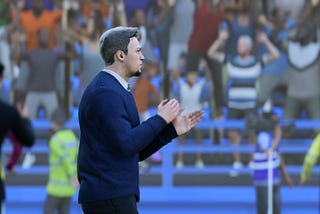 Sheffield Wednesday manager Josh Brewer applauds his team during a Premier League match at the Hillsborough Stadium.