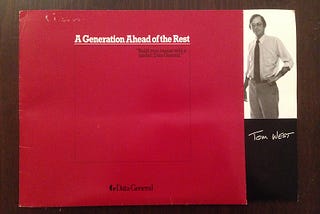 Data General brochure which is maroon and says “A generation ahead of the rest” and has a picture of my dad, a thin white man in his 30s standing on the side with his name underneath