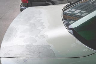 How do I prepare the body or fender of my car for spray painting?