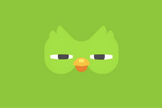 Image of the Duolingo owl with half closed eyes, looking suspicious