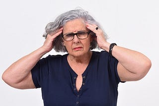 Woman holding her head in frustration
