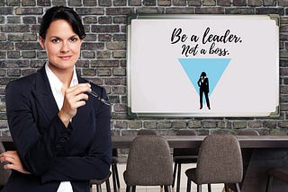 A leader and a message that says, ‘’Be a leader, not a boss.’’