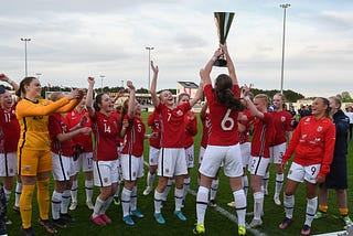 Soccer team wins cup.