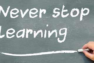 Chalkboard with the words Never stop Learning with Learning underlined