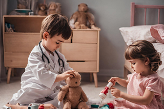 Peter and Helen are pretending to do a medical procedure on a bear.