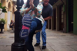Nandita Gupta posing for a front thrust kick, with her American Dad Eric jumping out behind her. Taken in New Orleans.