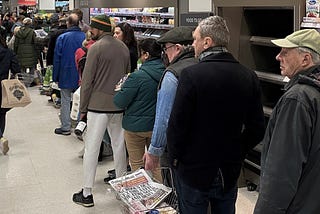 Line of people waiting at the supermarket.