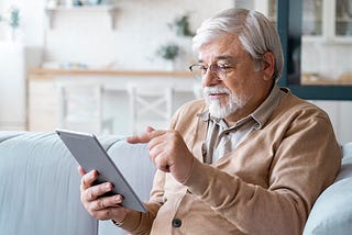 Older man using iPad