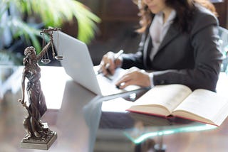 Attorney doing work at a computer