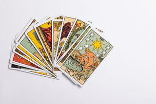 Tarot card spread in fan on white background