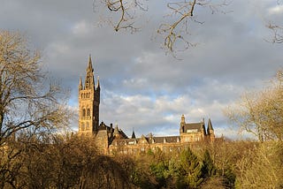 The University’s main building in warm winter sunlight, seen across Kelvingrove Park
