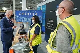 Biden speaks to Ford workers in front of a banner that reads, “A Future Made In America.”