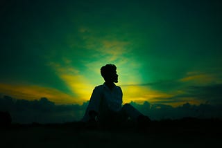 A person with sunlight illuminating them. You can only open your mind.