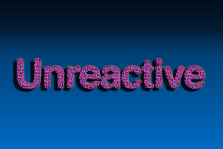 The word “Unreactive” made out of spheres that look like atoms. The spheres are purple and pink. The shadowing on the letters gives a depth effect.