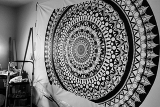 Mandala print on the cloth hanged on the wall