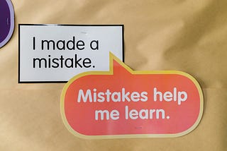 An encouragement note on brown paper.