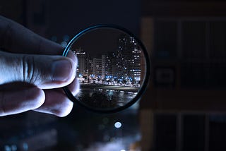 Someone is looking at the city through a magnifying glass