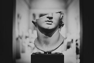 A sculpture with head chopped off/Photo by Levi Meir Clancy on Unsplash