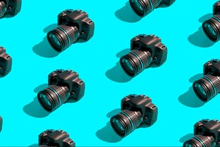 Multiple cameras on a cyan background