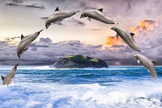 Six dolphins diving through the air and back into the ocean in a single arc.