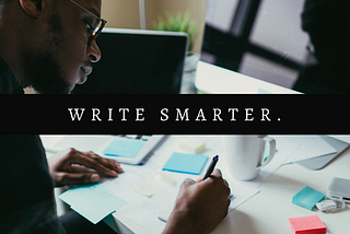 How to write on Medium article cover image. A Black person sitting in front of two monitors and writing on piece of paper. Learn how to write successfully on Medium.