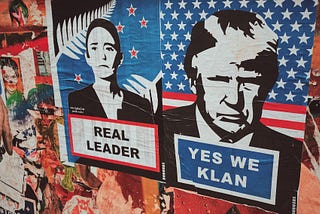 Graffiti wall with Trump face and “Yes We Klan” caption — New Zealand Prime Minister’s Jacinda Ardern  poster is next to it with “Real Leader” caption