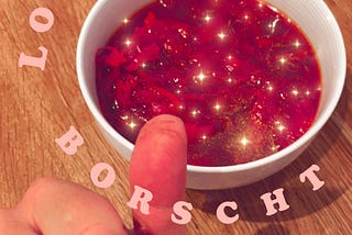 A bowl of borscht with my thumb next to it. The thumb has stained lines.