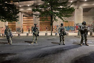 Federal Marshals in front of the Portland Federal courthouse building