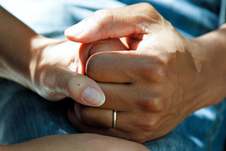 two people holding hands