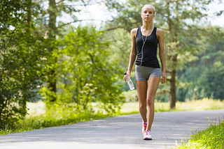 A young woman jogging in the nature
