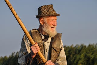 An old man fishing.