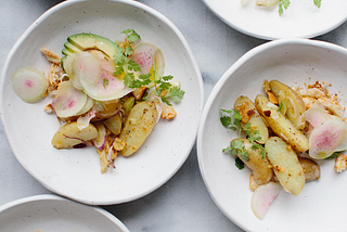 Spring potato salad with avocado, radishes and mustard croutons