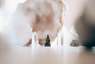 clear crystal wands and a Buddha ornament