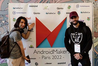 Pablo and Jordan in front of AndroidMakers banner