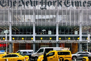 Vehicles parked in front of the New York Times building