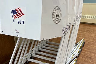 Voting privacy booths stacked up at a polling place