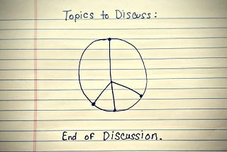 On a note pad it is written, ‘Topics to Discuss’ then Peace symbol, followed by ‘End of Discussion’