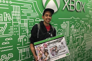 Chris (DeafgamersTV) Robinson holding a Tekken 7 Xbox fightstick at a Microsoft Conference in Seattle, WA.