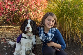 My daughter with our service dog.