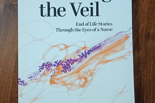 My well-worn and twice read copy of “Touching the Veil”.