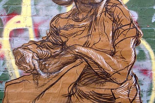 Charcoal drawing of a woman reaching into a seed bag on craft paper pasted over a graffiti mural brick wall “Sally Sows”