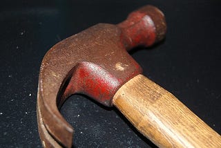 Traditional hammer on tabletop