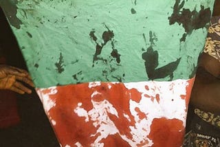 The Green-White-Green Nigerian Flag drenched in the blood of innocent Nigerians.