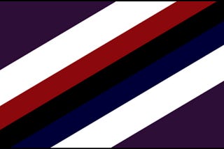image description: a flag with seven diagonal stripes. from top to bottom they are: dark purple, white, red, black, dark blue, white, dark purple. the purple stripes are widest and within the borders of the flag form mirror scalene right triangles in the top left and bottom right corners. The white stripes are half as wide as the dark purple, and the red, black, and dark blue stripes are half as wide as the white.