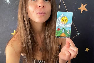 Rozalia Kieliszkiewicz holding the Ace of Pentacles Major Arcana Tarot Card