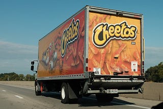 Cheeto truck on the road.