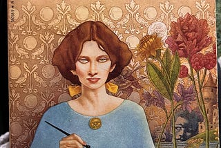 Yellowed, aged front cover of the book Eva Luna by Isabel Allende. Showing a woman with brown hair in a bob. She’s sitting at a desk holding a fountain pen with red flowers behind her. There is paper and a grenade on the desk.